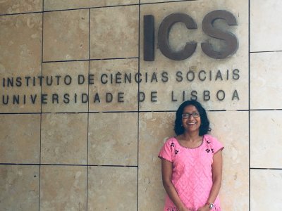 Bidisha stands in front of ICS sign