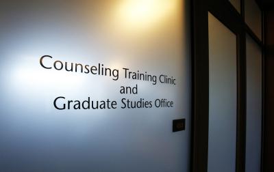 Photo of the "Counseling Training Clinic and Graduate Studies Office" sign outside of their office.