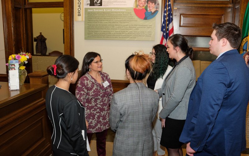 Students speaking with Justice Montoya-Lewis