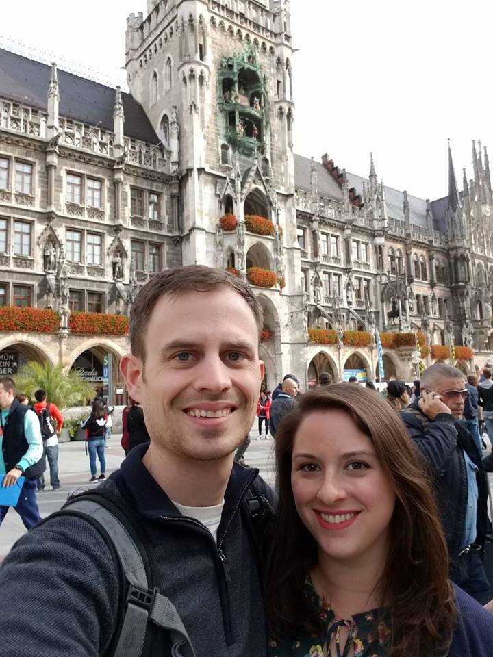 Lexi, right, and alumni Aaron Larson, left, standing in front of Munich's Neues Rathaus (New Town Hall)