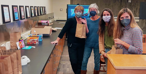 Linguistics faculty assembled goody bags to give to our first-generation students. From left, Dr. Judith Pine, Dr. Anne Lobeck, Dr. Virginia Dawson, and Dr. Kristin Denham