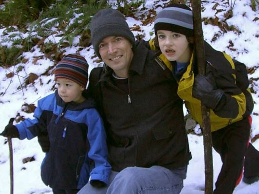 Ethan Remmell and two children in the snow