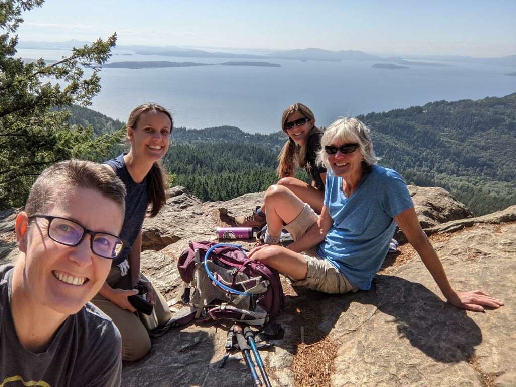 From left, Dr. Jordan Sandoval, Dr. Virginia Dawson, Dr. Kristin Denham and Dr. Anne Lobeck enjoy the view atop Blanchard Mountain.