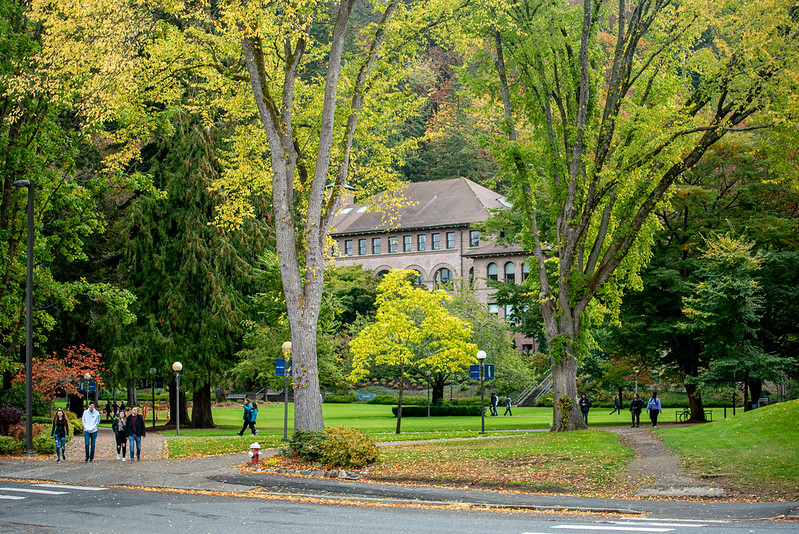 Old Main from the street, surrounded in leafy green trees