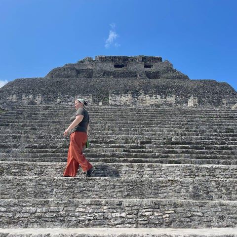 Adrena walking up the steps of a pyramid- El Castillo in Xunantunich, Belize