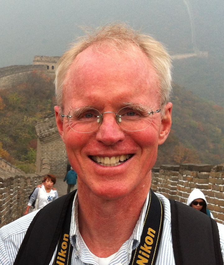 Headshot of Prof. Thompson taken on the Great Wall of China