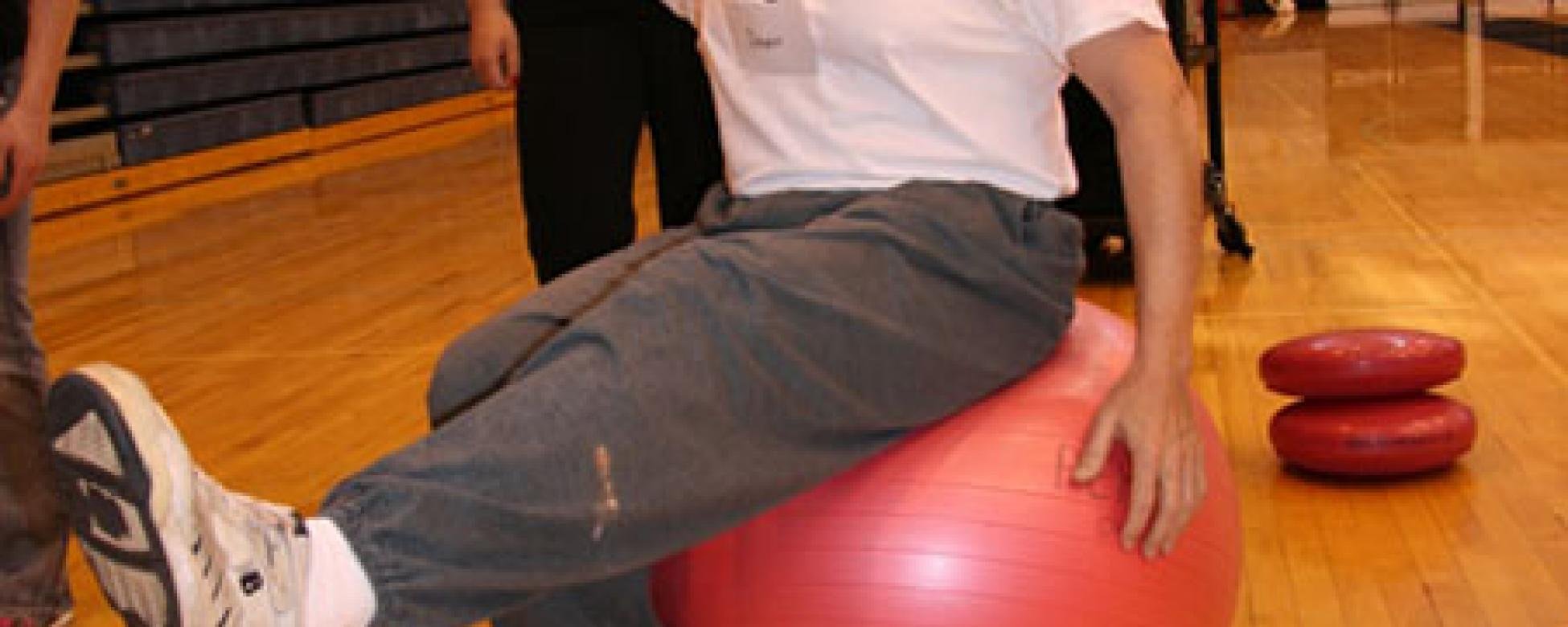 student on a ball performing exercise