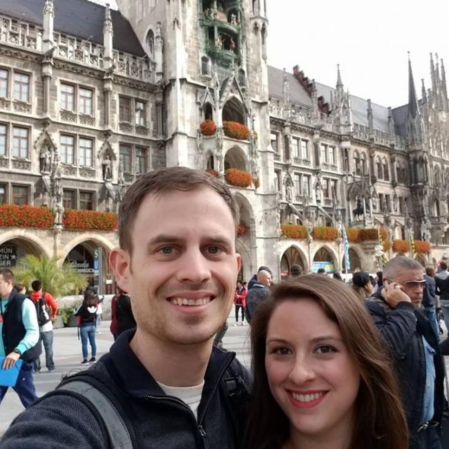 Lexi, right, and alumni Aaron Larson, left, standing in front of Munich's Neues Rathaus (New Town Hall)