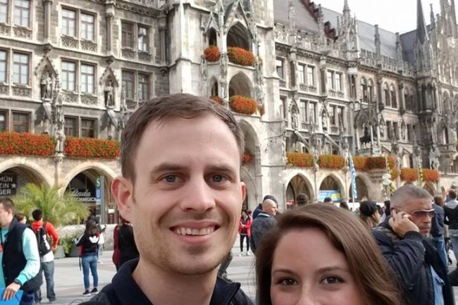 Aaron, left, and alumni Lexi Williams, right, standing in front of Munich's Neues Rathaus (New Town Hall)