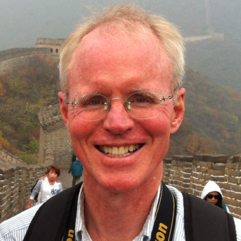 Headshot of Prof. Thompson taken on the Great Wall of China
