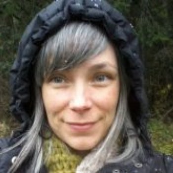 Jennifer Gruenert, CCC-SLP wearing a hood on a rainy day.