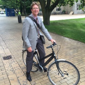 Ira on his bicycle on WWU campus bricks