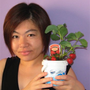 Michi holding a pot of plants