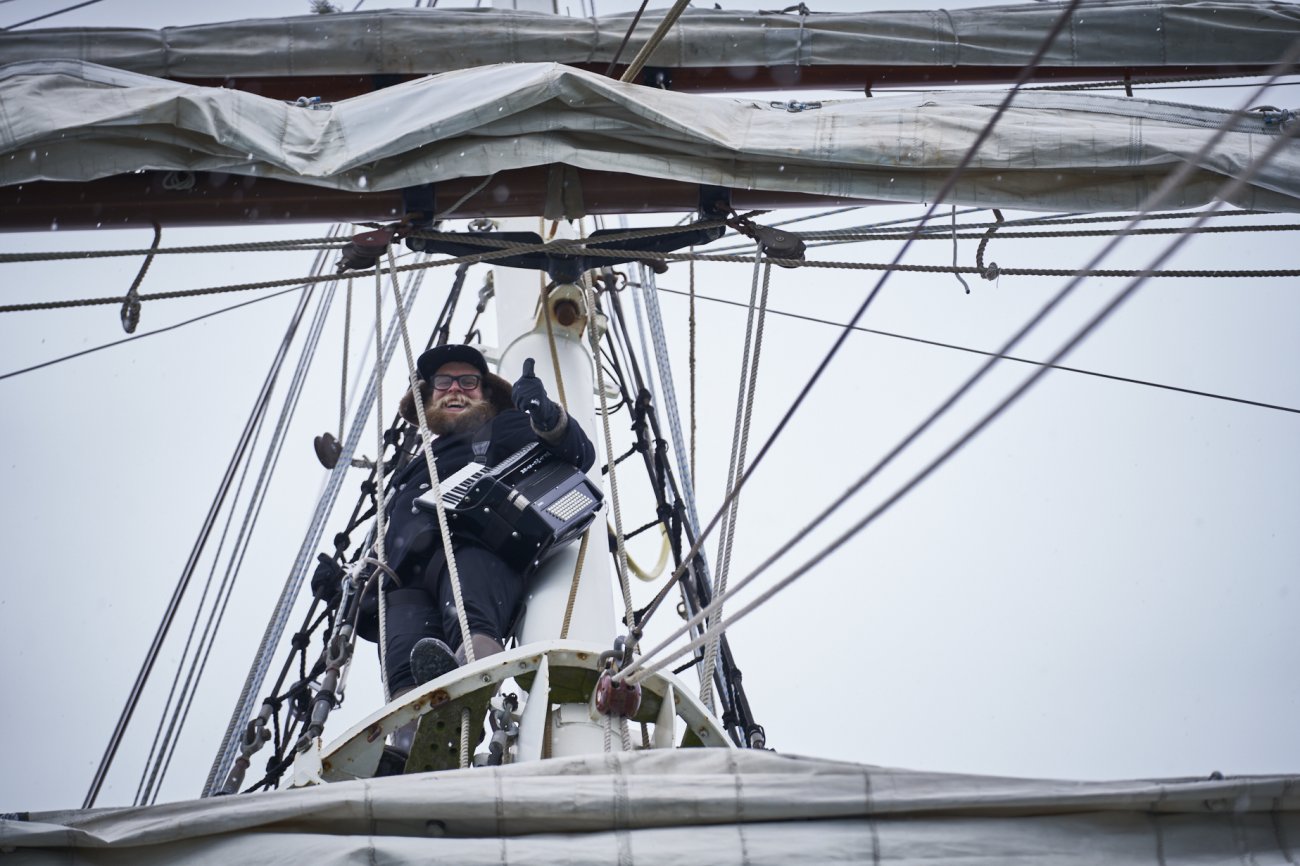 Srangely sitting in mast of boat in the Artic.