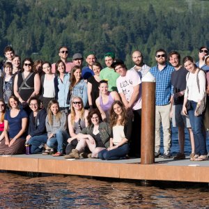 English department students standing on a dock at the edge of a lake