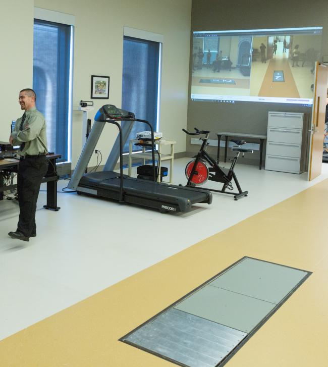 picture of force plate in floor with treadmill in background