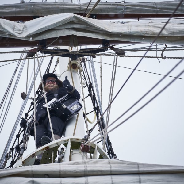 Srangely sitting in mast of boat in the Artic.