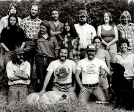 archaeology students and a blonde dog pose in a field circa 1970
